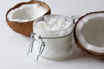 coconuts and coconut oil on a wooden background.