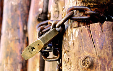Padlock and old wooden door