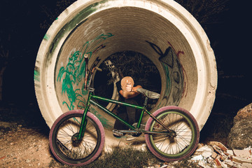 Young man standing bmx bike. BMX rider 