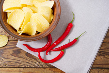 potato chips,hot red peper, napkin on wooden table background, mock up