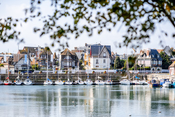 Fototapeta na wymiar Landscape view of beautiful marine with yachts and buildings in Deauville town in France