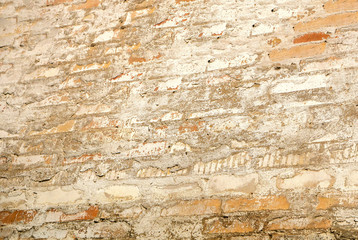 The texture of a stone fence made of granite. Background
