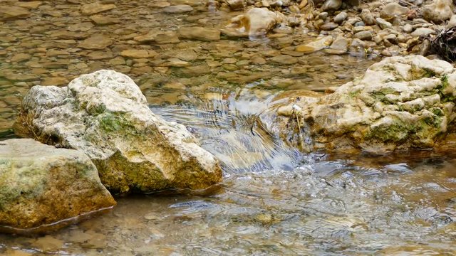 Stones form a dam on the river