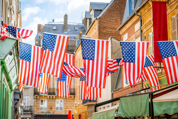 Big american flags on the street of the old town