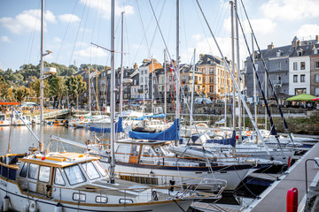 Landscape view on the beautiful harbour with yachts and old buildings in Honfleur, famous french town in Normandy