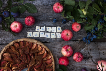 Apple pie on wooden rustic background.