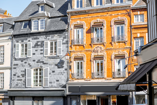 Beautiful facades of the old buildings in the central square in Honfleur, famous french town in Normandy