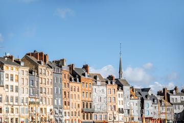 Waterfront with beautiful old buildings in Honfleur, famous french town in Normandy