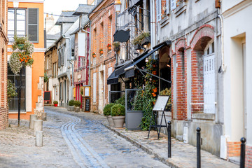 Street view with beautiful old buildings in Honfleur, famous french town in Normandy © rh2010
