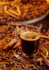 Espresso coffee cup with cinnamon sticks.