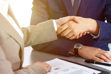 Obraz premium Business people shaking hands, finishing up a meeting. Papers signing, agreement and lawyer consulting concept