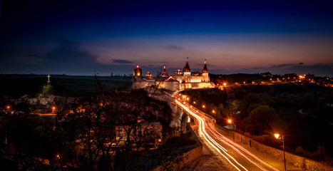 Fototapeta na wymiar Ukrainian Kamianets-Podilskyi fortress at sunset