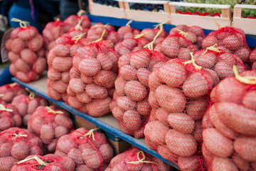 Bagged potatoes for sale on local street market.