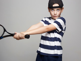 Child Boy Playing Tennis. Sport kids
