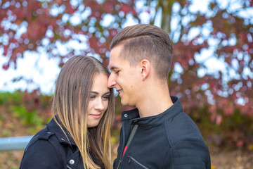 Funny couple laughing with a white perfect smile