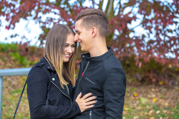 Funny couple laughing with a white perfect smile