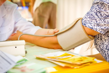 Russia, Samara, 2016: Flower Festival. Samara. The paramedic examines blood pressure at the rest.