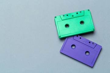 Bright retro cassette tapes on a light grey background