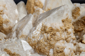 Macro mineral stone Snow quartz with calcite on a black background