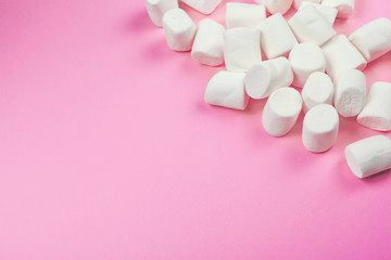 Marshmallows on pink background