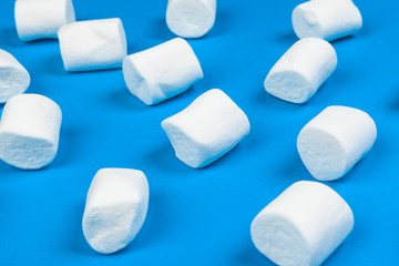 Marshmallows on blue background