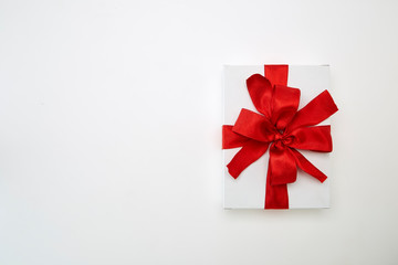 single gift box with red ribbon