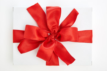 single gift box with red ribbon
