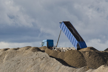 TRUCK - Vehicle on the heap of stored building material © Wojciech Wrzesień