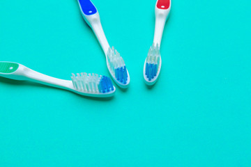 Flat lay composition with manual toothbrushes on color background, close up