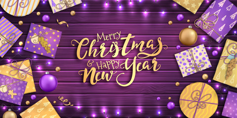 Merry Christmas and happy new year banner with Christmas decoration: colorful balls, purple and gold gift box, garland on wooden background. Xmas holiday greeting card, beautiful Christmas sale poster
