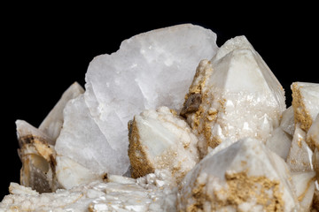 Macro mineral stone Snow quartz with calcite on a black background