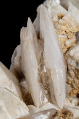 Macro mineral stone Snow quartz with calcite on a black background