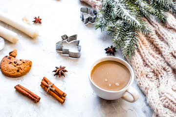 Christmas evening with cup of cocoa white background top view
