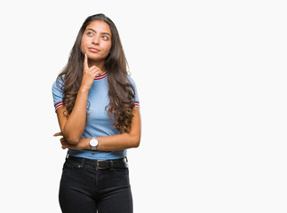 Young beautiful arab woman over isolated background with hand on chin thinking about question,...