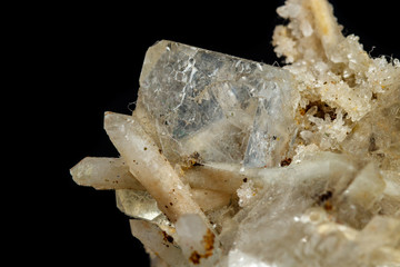 Macro mineral stone fluorite with quartz against black background