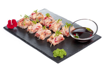 Black rectangle plate with sushi, isolated on white