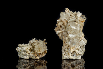 Macro mineral stone fluorite with quartz against black background