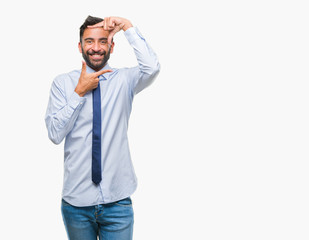 Adult hispanic business man over isolated background smiling making frame with hands and fingers with happy face. Creativity and photography concept.