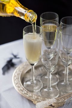 Pouring sparkling wine into a glass