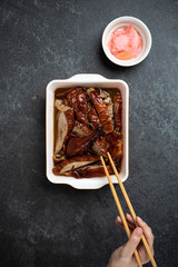 roasted duck crispy skin asian style on top of table background flat lay top view
