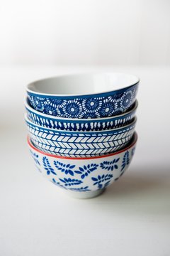Close up of blue and white patterned bowls