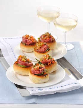 Pane condito con cotechino (rolls topped with raw sausage meat, Italy)