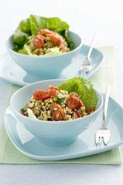 Tabbouleh on green lettuce leaves