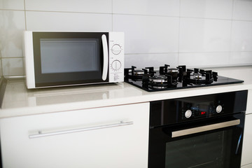 Fototapeta premium Modern kitchen interior with electric and microwave oven. 