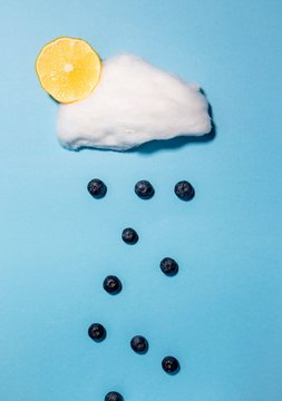Blueberries falling from a candyfloss cloud