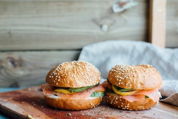 Sesame seed buns on wooden board