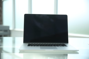 close up. open laptop on glass table.