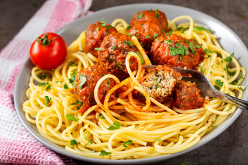 Spaghetti with pork and beef meatballs and tomato sauce