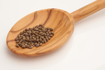 Hemp seeds on wooden spoon