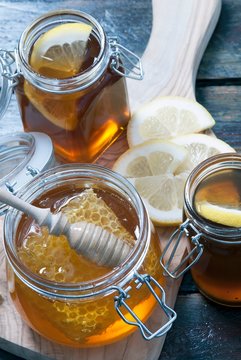 Organic honey with honeycomb in mason jar